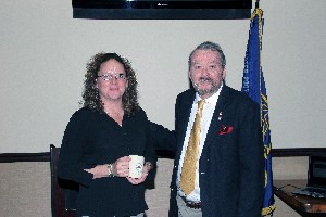 Paul Wickstrom, chapter executive vice president, thanks Barbara Tinetti from ITT Corporation's force protection systems (FPS) division for serving as a guest speaker in November.